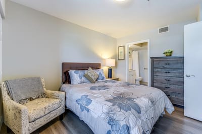 Cozy bedroom with floral bedding and natural light