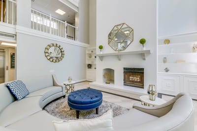 Modern interior design of a common area with sofa and fireplace