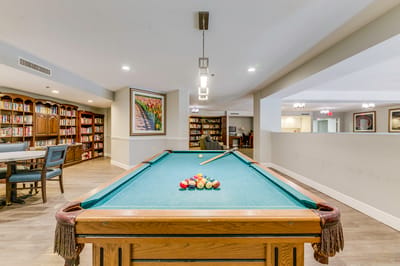 Interior view of a game room with a pool table
