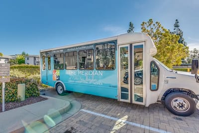 Facility shuttle bus parked in the outdoor area