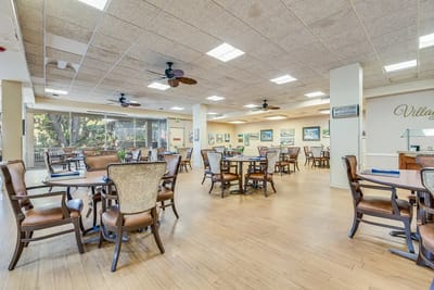 Spacious dining room with tables and chairs