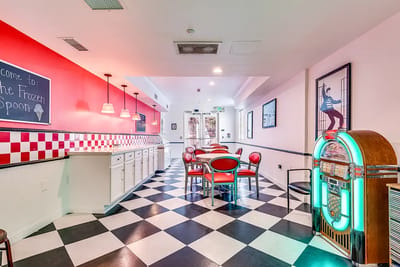 Brightly colored dining area with a jukebox