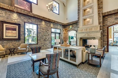 Interior view of a stylish lobby with stone walls