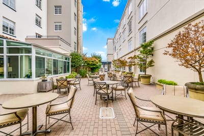 Outdoor courtyard with seating and greenery
