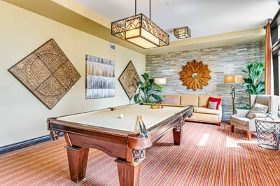 A well-decorated billiard room in a community space