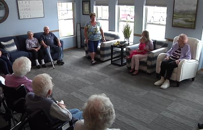 Residents participating in a group activity in a common area