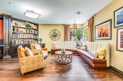 Interior common area with seating and bookshelves