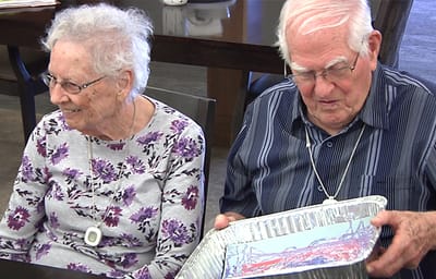 Two residents enjoying an activity together indoors