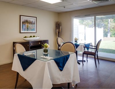 Indoor dining area with tables and chairs