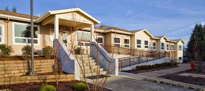 Exterior view of a senior living facility with accessible entrance