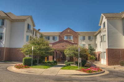 Front entrance of Milestone Senior Living facility with landscaping