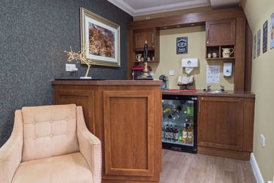 Well-furnished lounge area with a bar setup