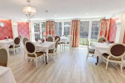 Bright dining room with elegant decor and tables