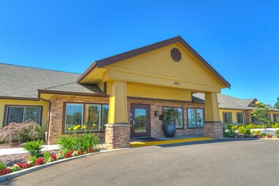 Entrance of Milestone Senior Living facility with landscaping