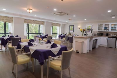 Bright dining area with tables set for meals
