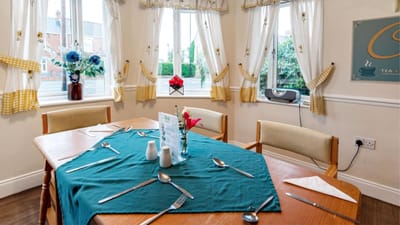 Well-set dining room with a table and decorations