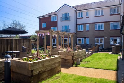 Outdoor garden area with seating and flower boxes
