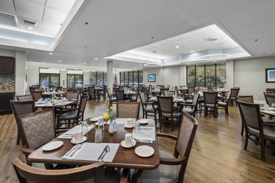 Dining area with tables set for a meal