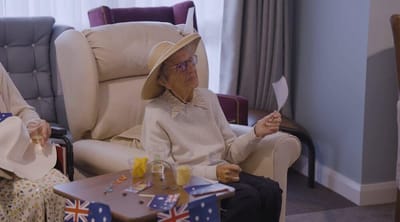 Resident enjoying a festive activity in a cozy setting