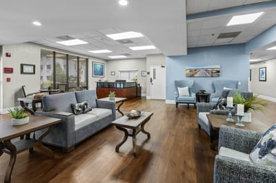 Cozy common area with seating and a reception desk