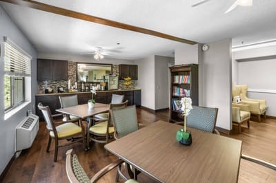 A cozy common area with tables and seating