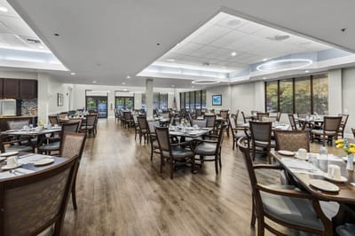 Dining room setup with tables and chairs
