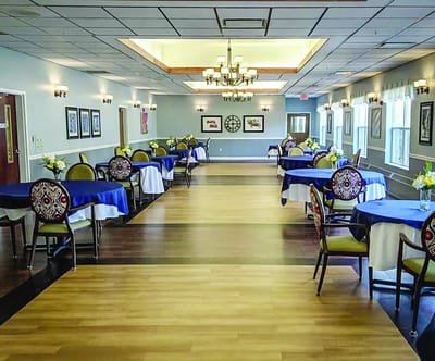 Dining area with tables set for residents