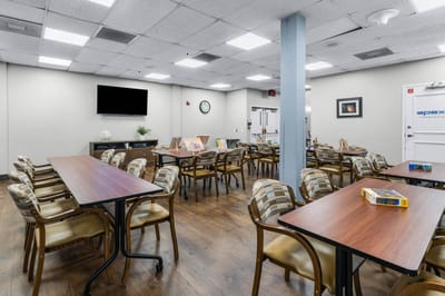Dining area featuring tables and chairs in a bright interior