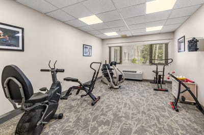 Fitness room with exercise equipment and natural light