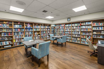 Interior of a library with bookshelves and tables