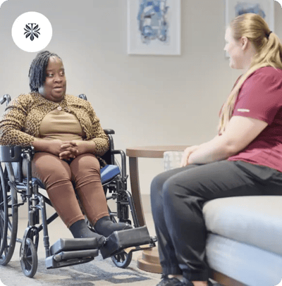 Residents engaging in conversation in a cozy common area