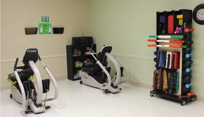 Rehabilitation exercise equipment in a therapy room