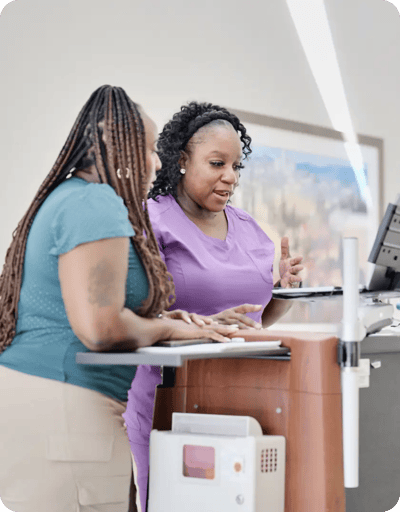 Staff assisting a resident at a facility