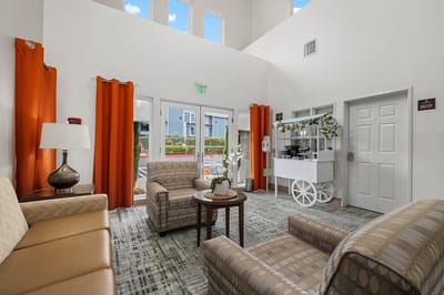 Bright interior common area with seating and decor