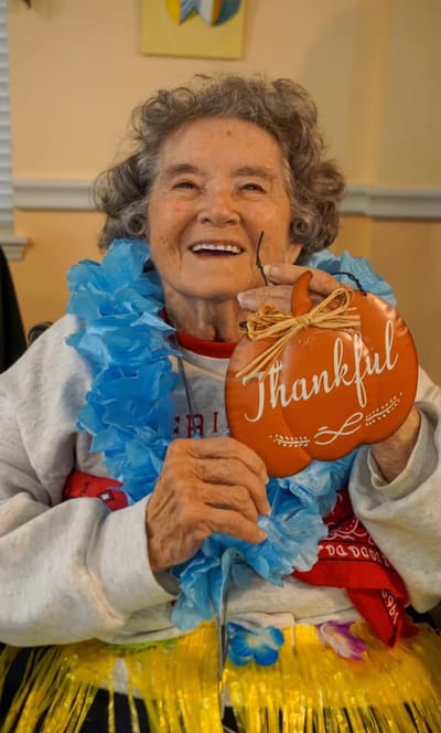 Resident celebrating with a thankful decoration