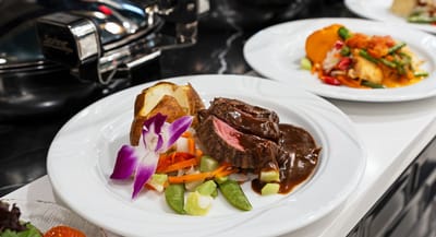 Plated meal featuring meat and vegetables