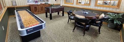 Common area with shuffleboard and foosball tables