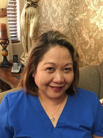 Nurse smiling in assisted living facility interior