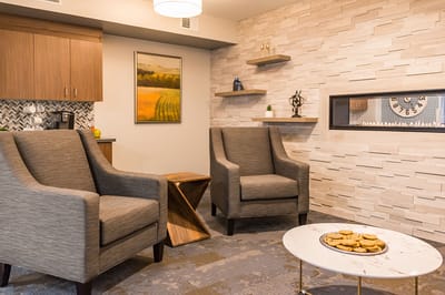 Cozy common area with chairs and cookies