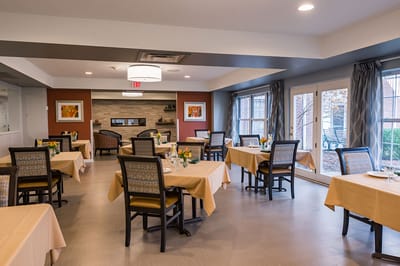 Bright dining area with tables and chairs