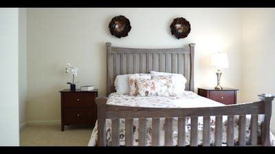 Cozy bedroom with floral bedding and decor