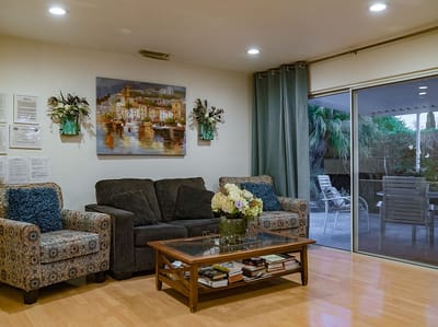 Cozy common area with a couch and artwork.