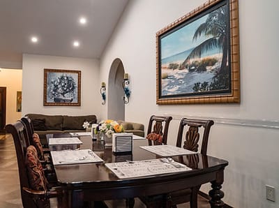 Cozy dining area with table and artwork