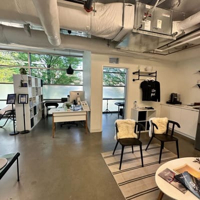 Interior view of a therapy room with a desk and chairs.