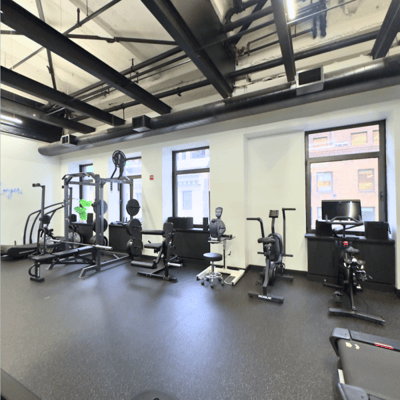 Interior view of a gym with exercise equipment.