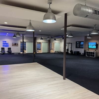 Interior view of a physical therapy space with equipment