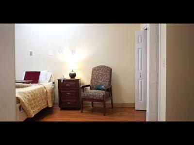 Cozy private room with a bed and chair