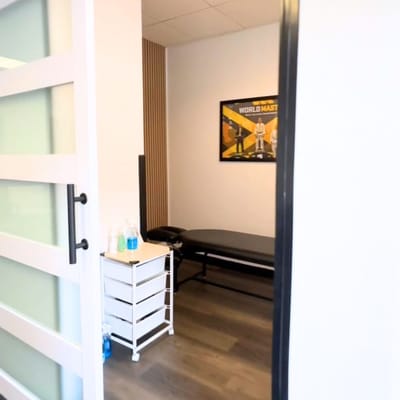Physical therapy room with a treatment table.