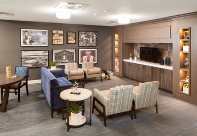 Bright common area with comfortable seating and artwork