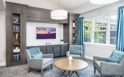 Bright and welcoming common area with seating and decor